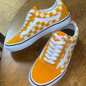 Size 7W or 5.5M Orange checkered Vans